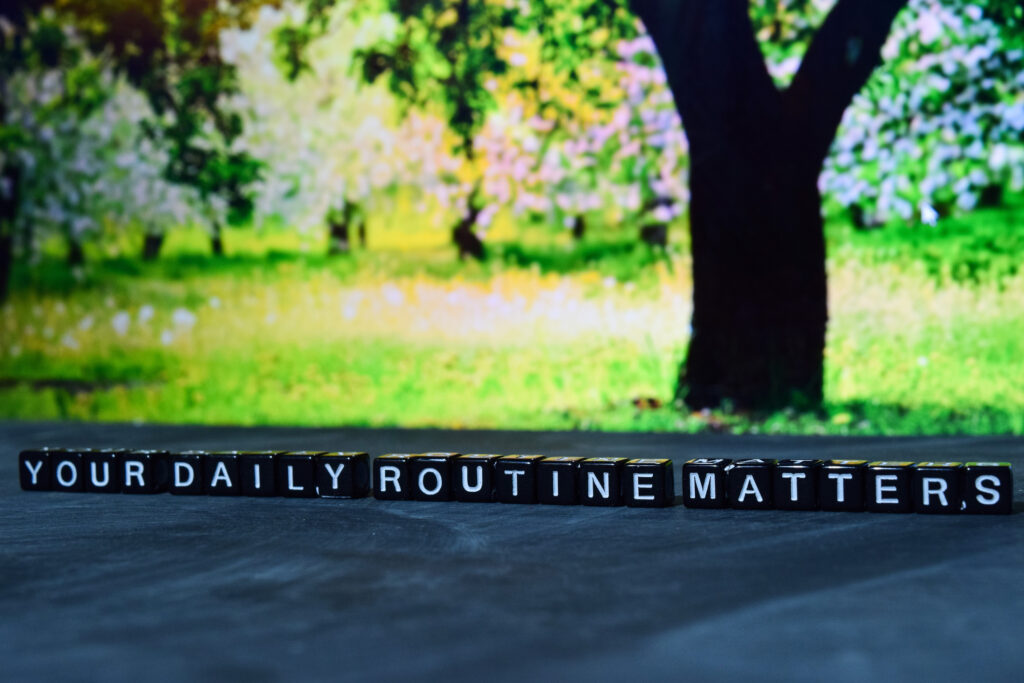 Your daily routine matters on wooden blocks. Cross processed image with bokeh background